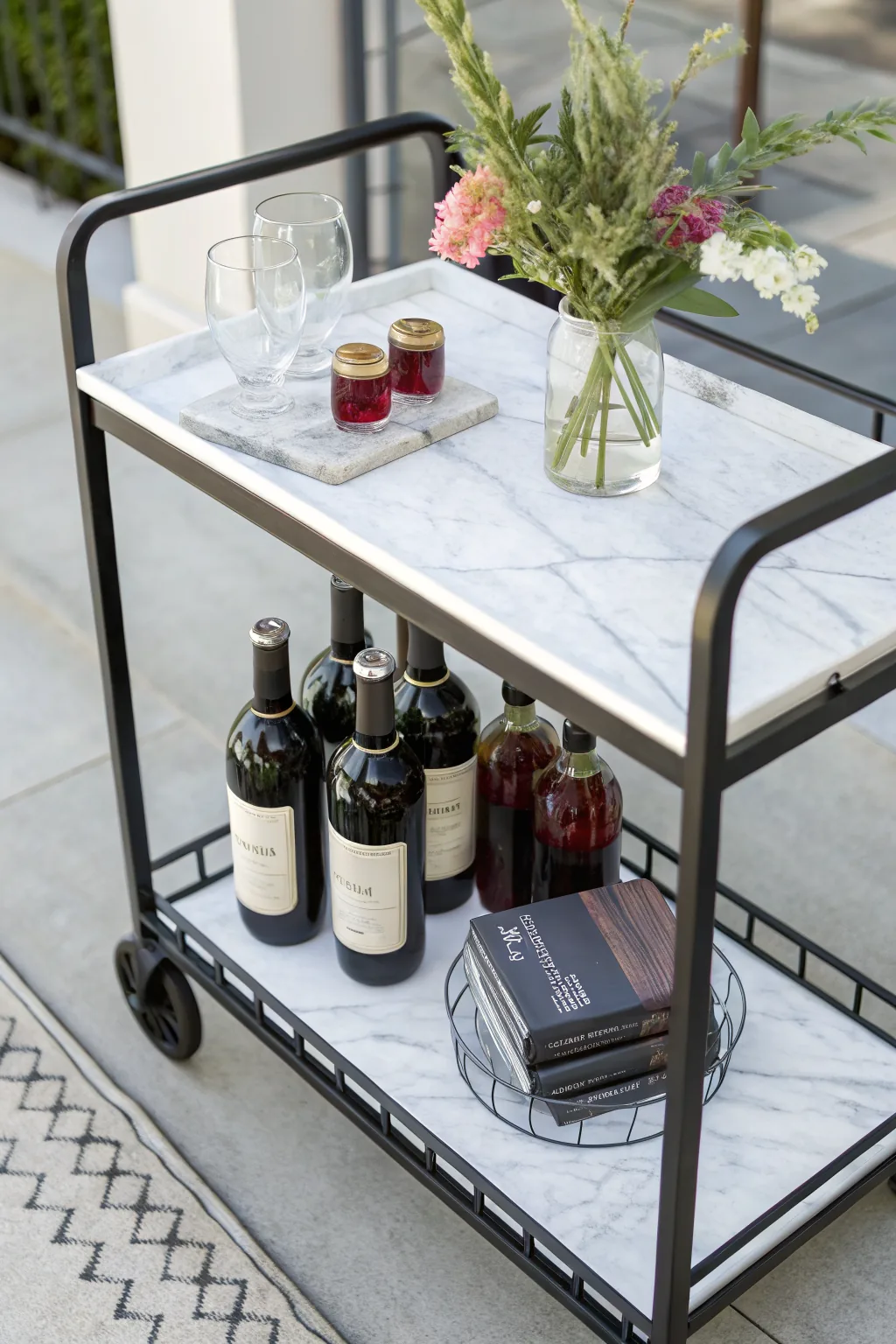 Matte black bar cart with marble shelf
