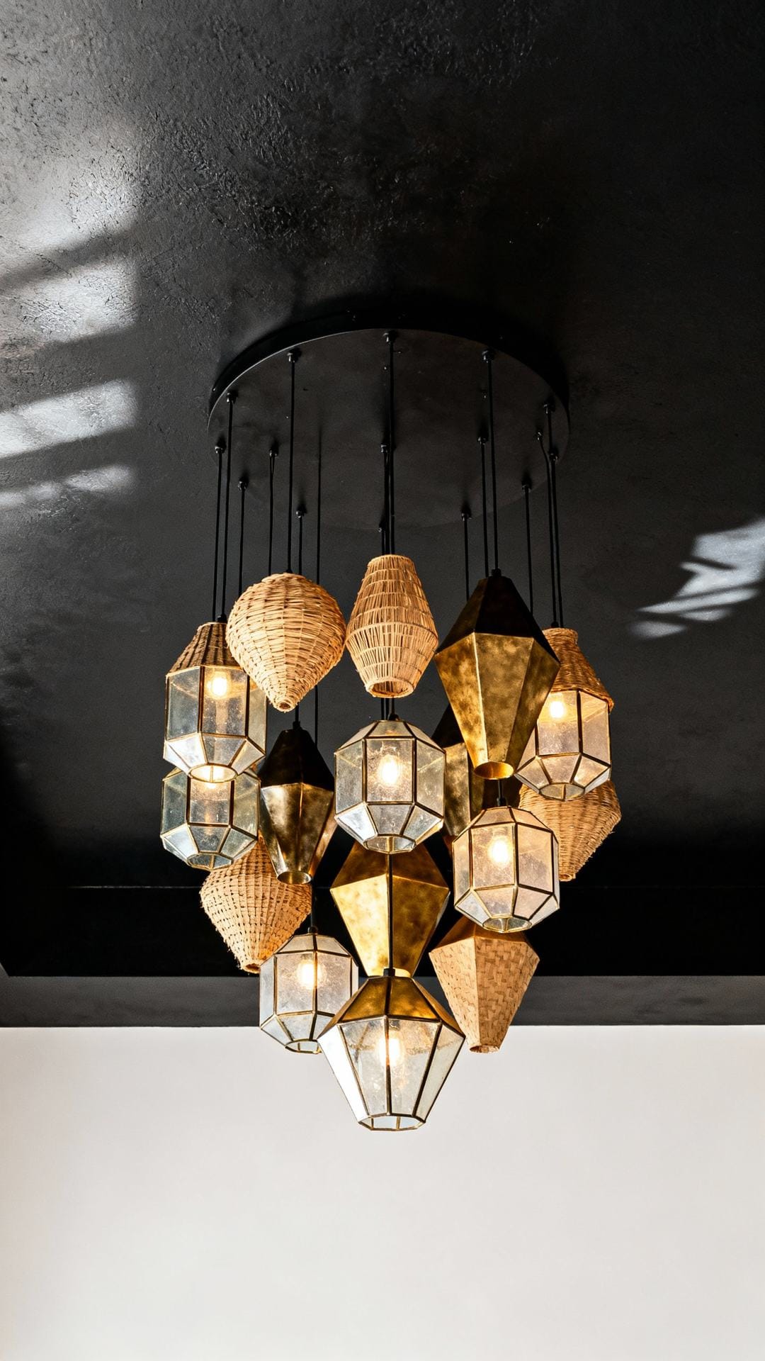 Oversized Pendant Cluster Under a Matte Black Ceiling