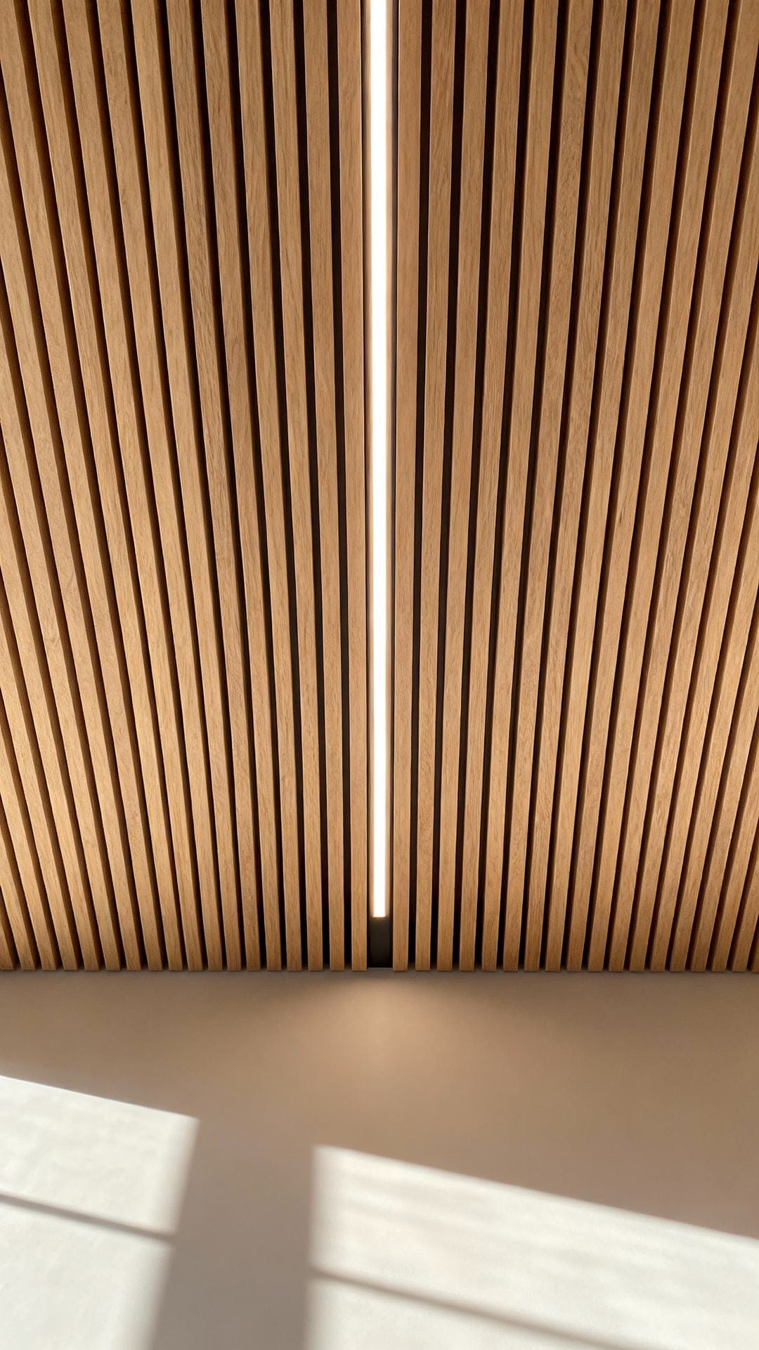 Slatted Wood Ceiling With Integrated Linear Lights