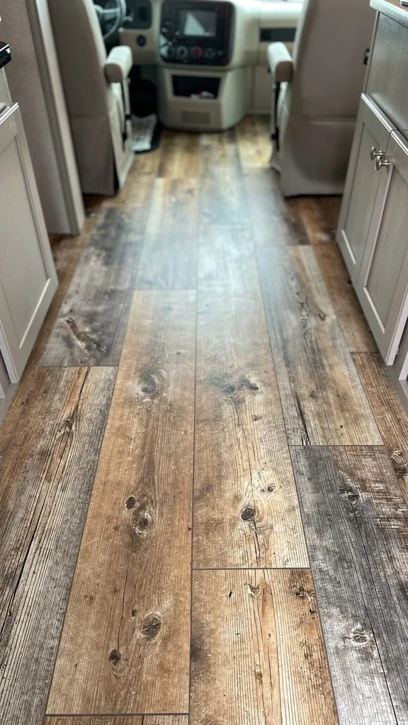 Light wood-look vinyl plank flooring in a camper