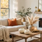 Fall living room decor with layered textures, warm tones, candlelight and cozy throws for a snug seasonal space