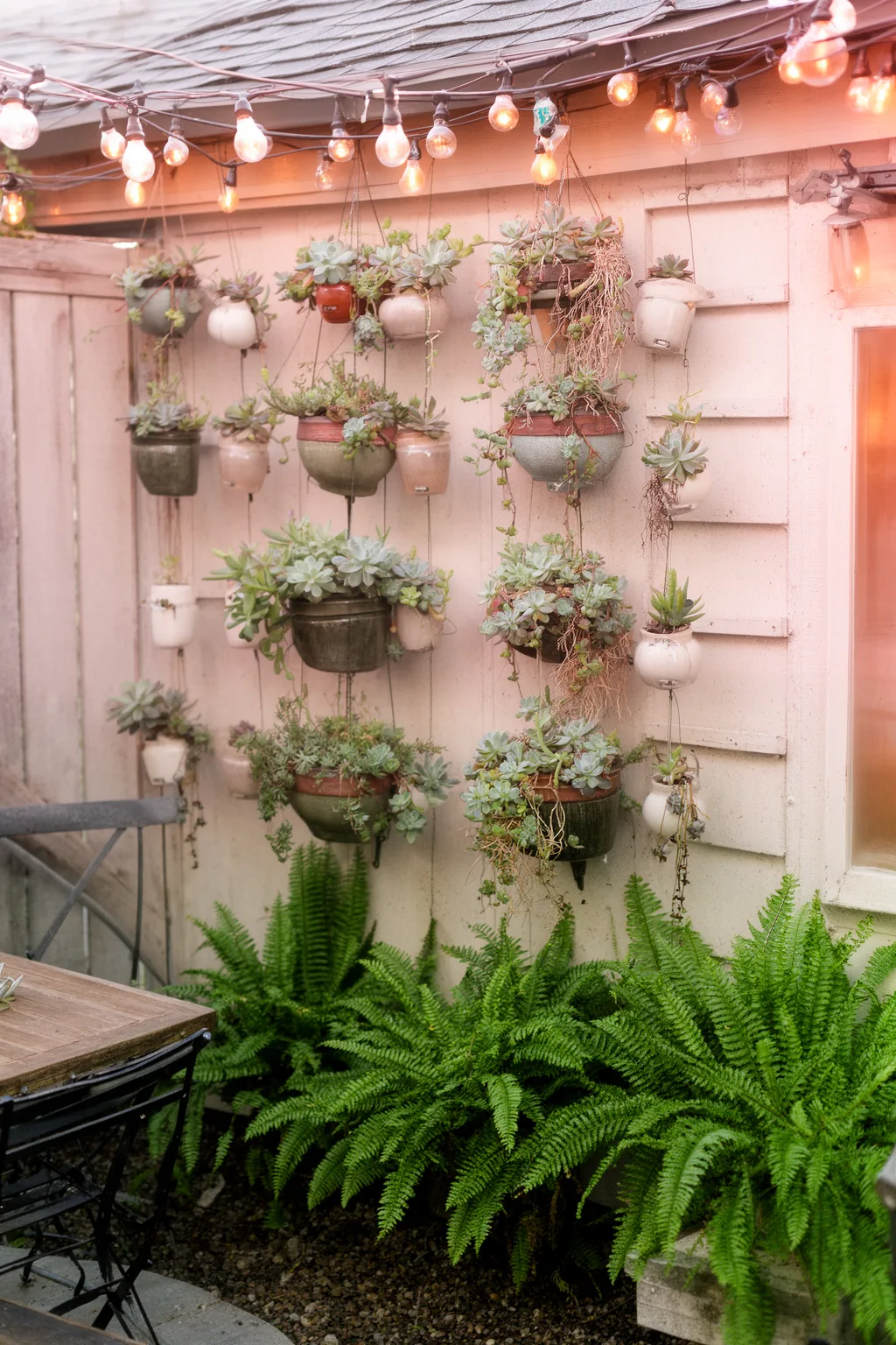 Vertical hanging planters arrangement patio
