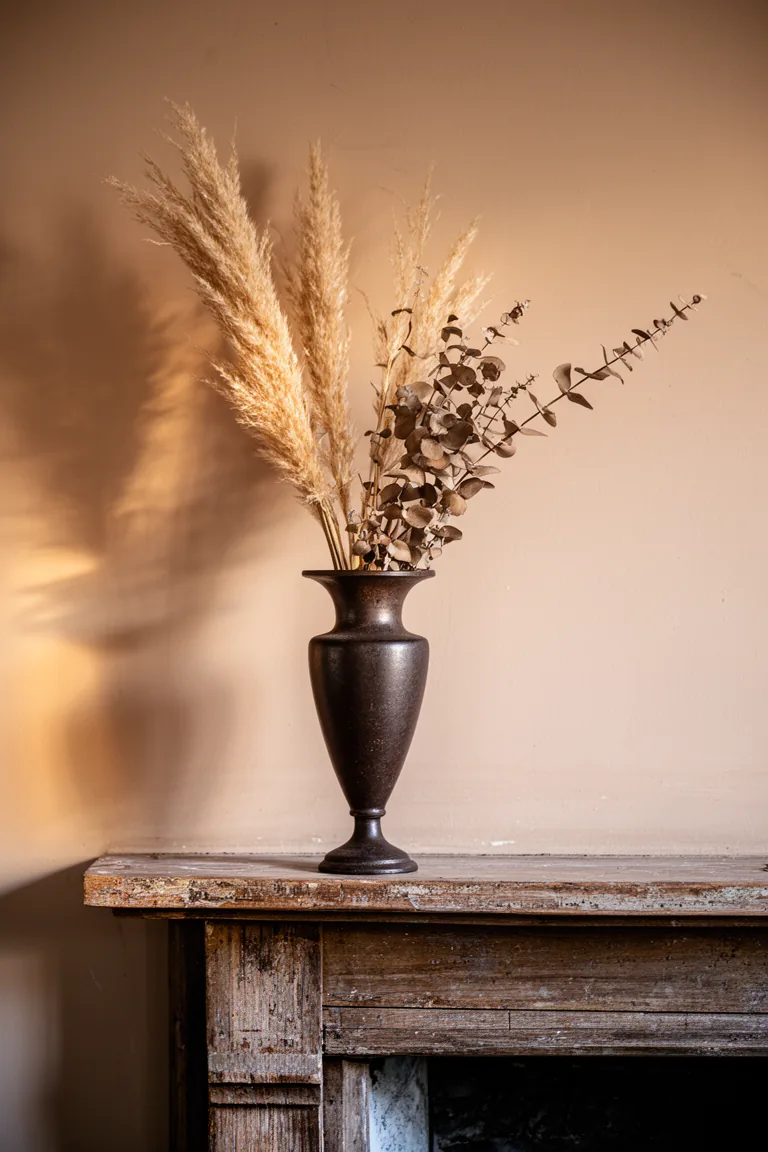 Cast iron urn arrangement on a rustic vintage mantel variation 5