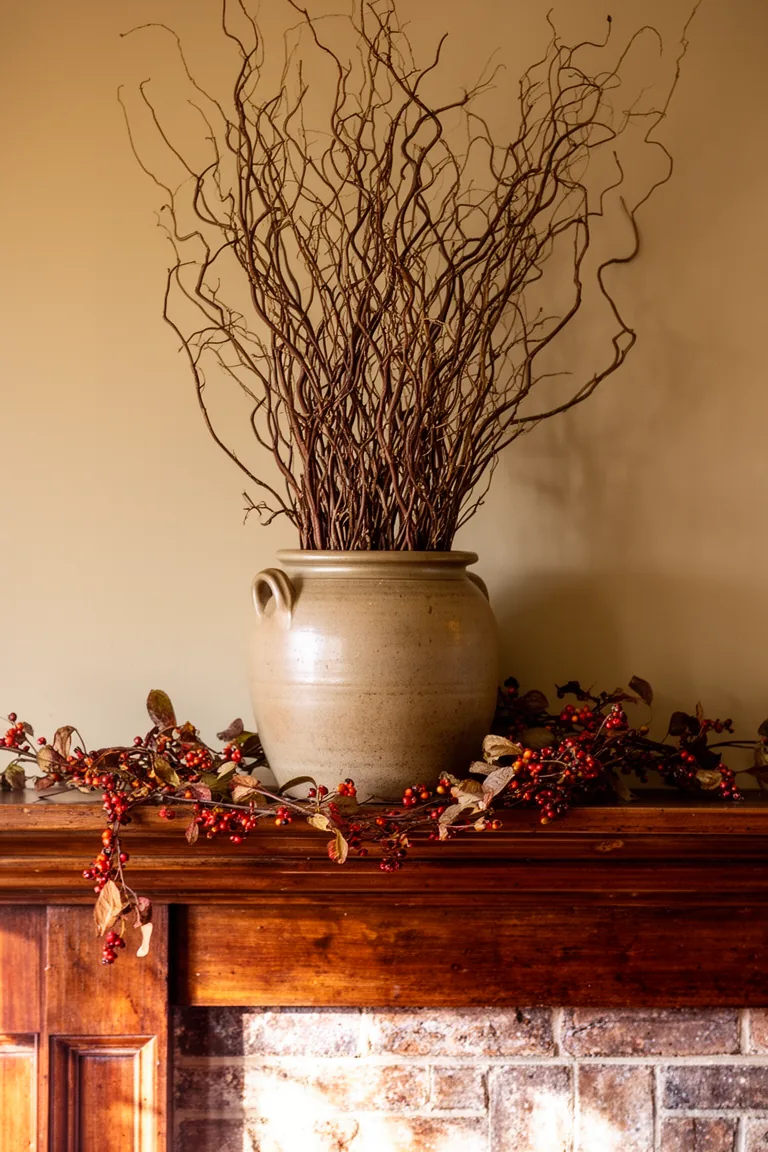 Stoneware pitcher with branches on a rustic vintage mantel variation 3