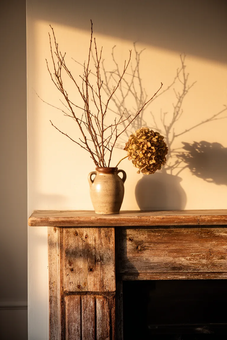 Stoneware pitcher with branches on a rustic vintage mantel variation 4