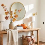 Cozy fall entryway table with layered runner, brass, and seasonal accents