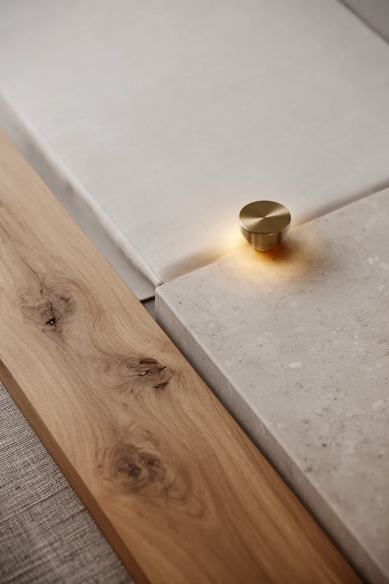 Natural wood, linen and stone textures with one brass accent