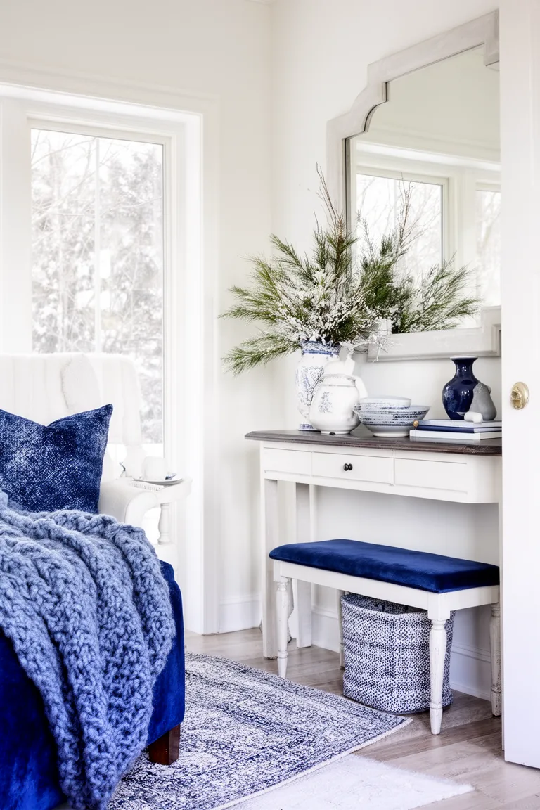 Bright blue and white entryway console vignette