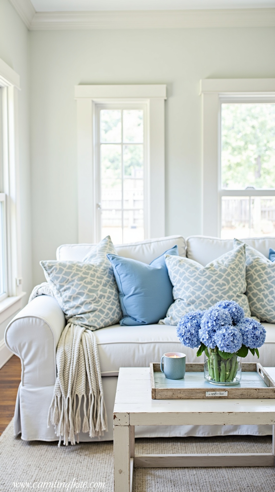 Coastal grandmother living room in blue and white with hydrangeas, photo 4 of 5