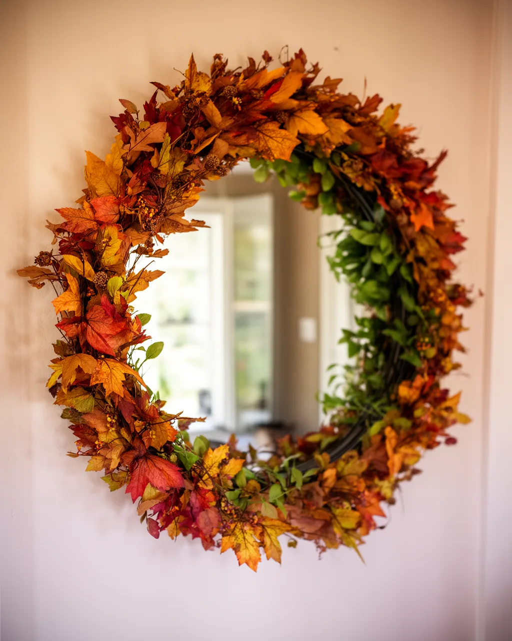 Fall garland looped over an entryway mirror