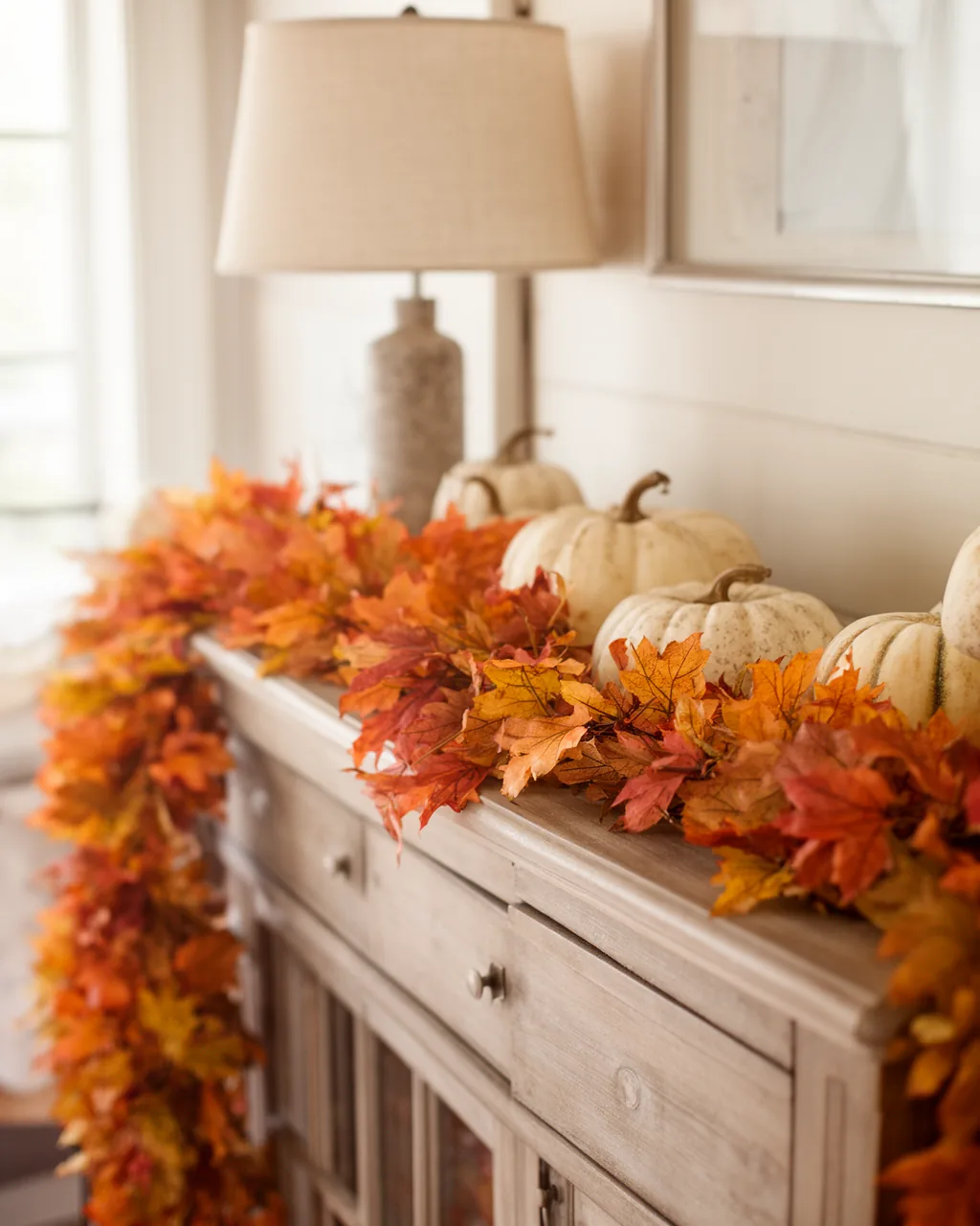 Fall garland on an entryway console table