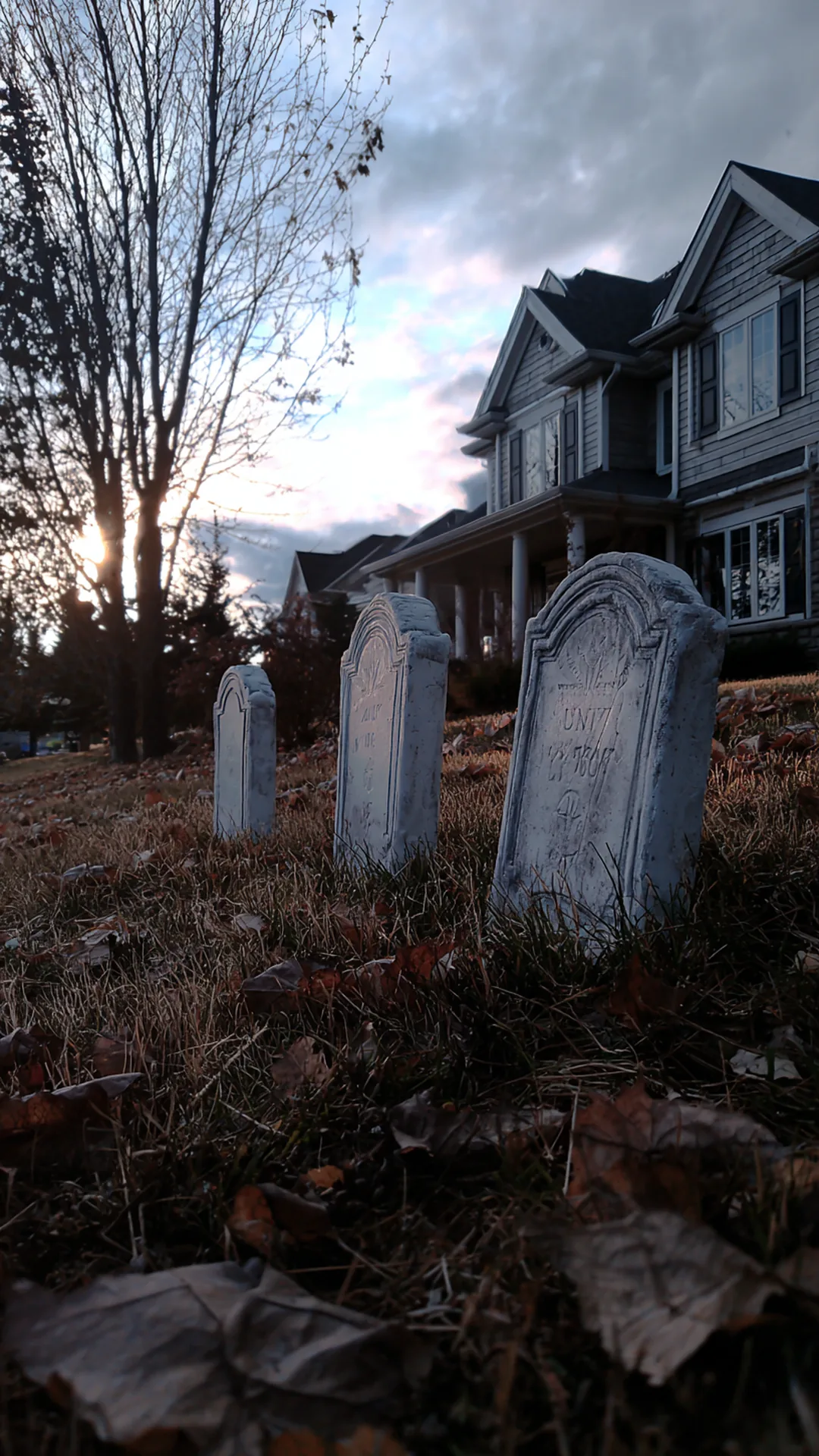 diy foam tombstones anchored in a front lawn — photo 1 of 5