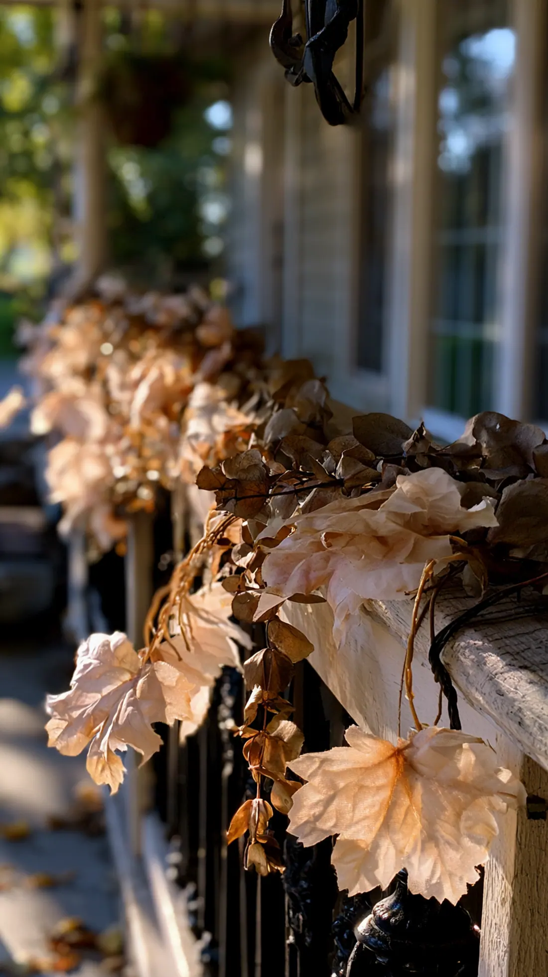 A fall porch garland hung from weatherproof outdoor hooks, photo 1 of 3