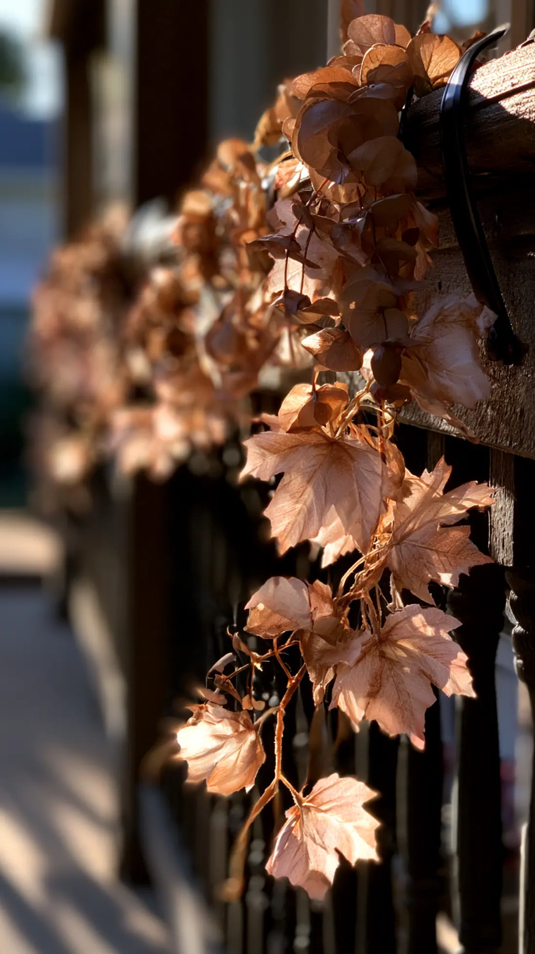 A fall porch garland hung from weatherproof outdoor hooks, photo 2 of 3