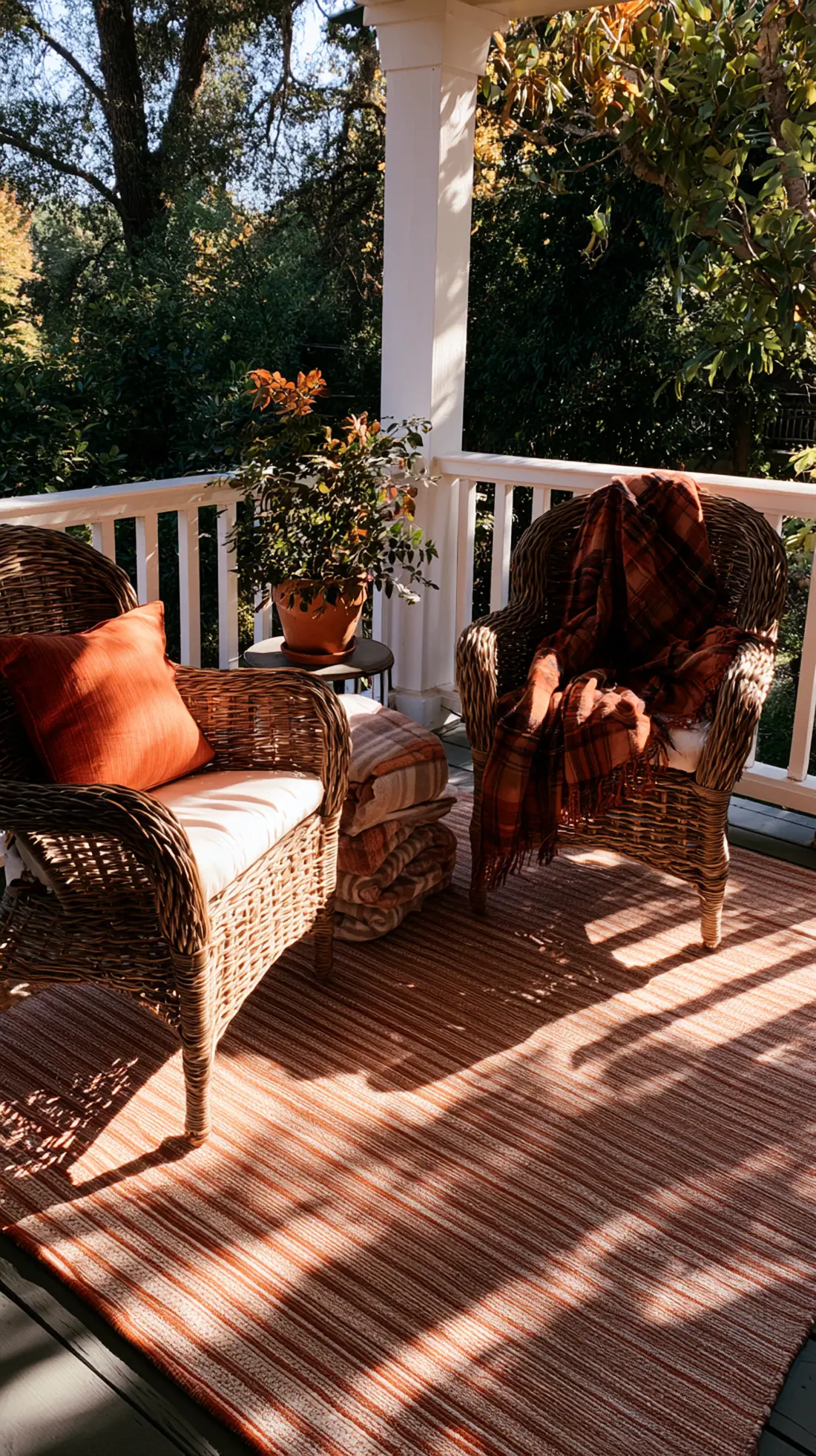 A rust and cream outdoor rug anchoring a fall porch seating area, photo 4 of 4