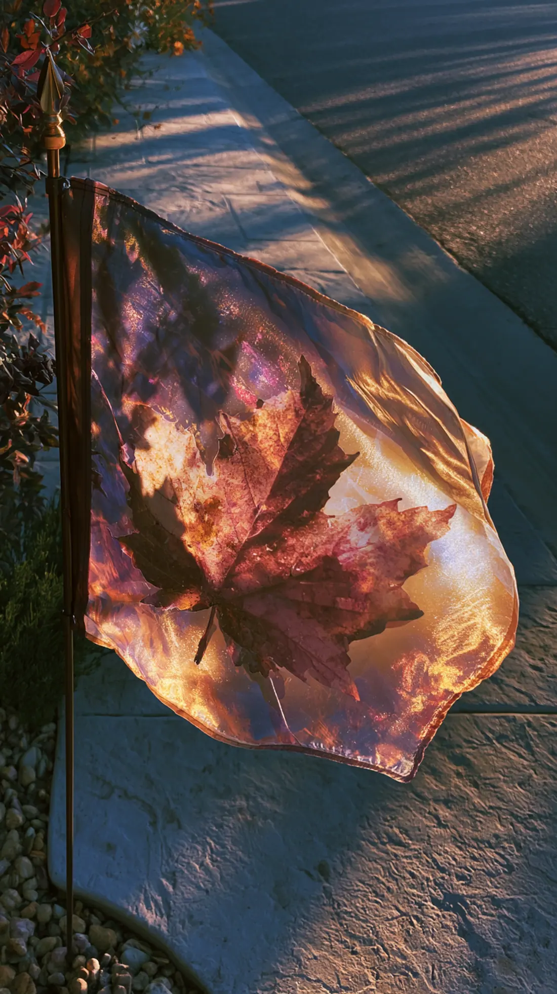 A fall-themed garden flag mounted on a steel ground spike near the front walk, photo 2 of 4