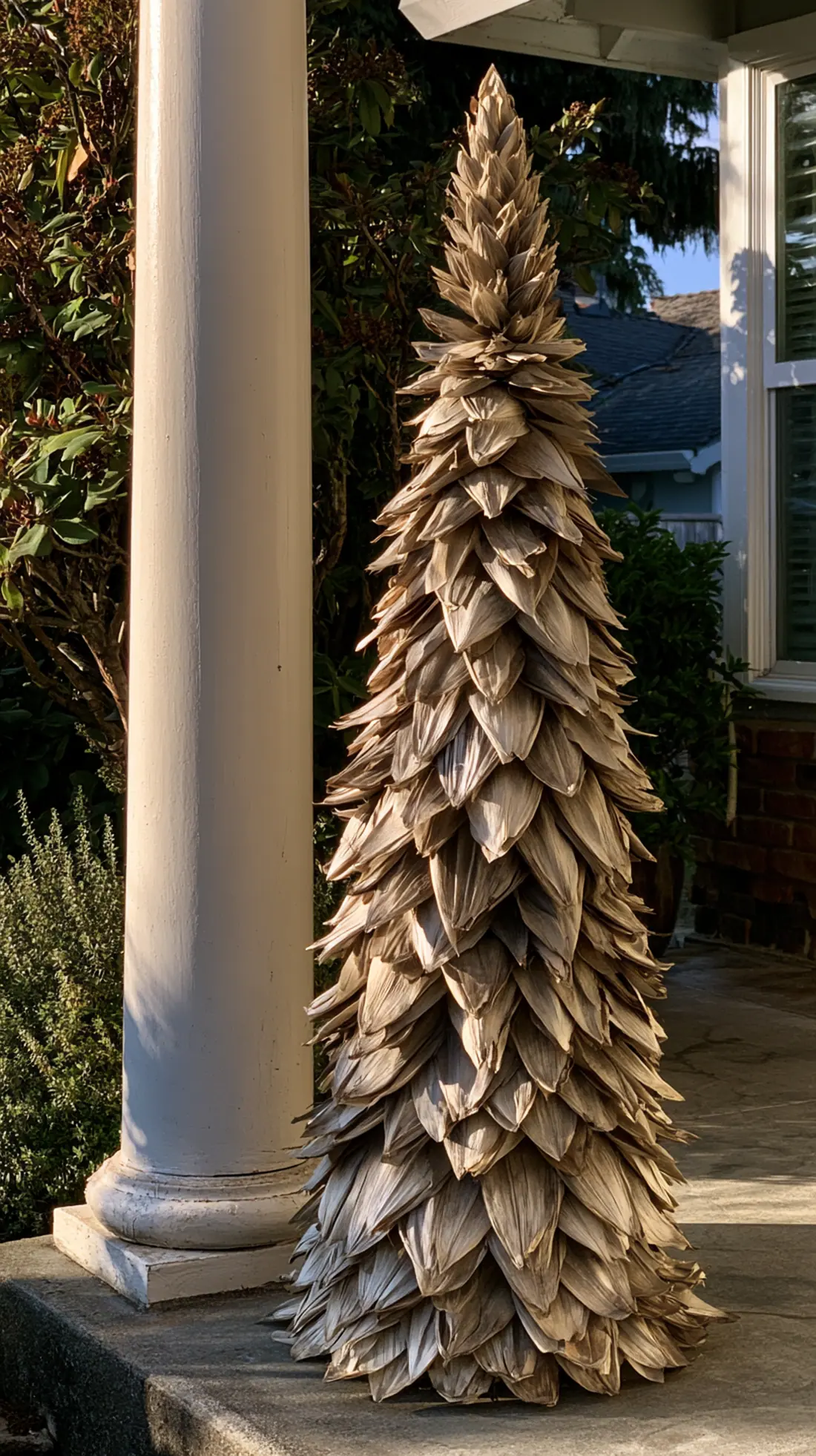 A cone-shaped corn husk topiary built around a hidden PVC frame, photo 1 of 4