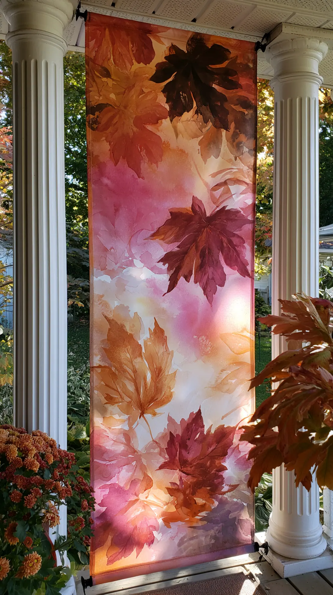 A canvas fall banner secured between two porch posts with zip ties, photo 2 of 4